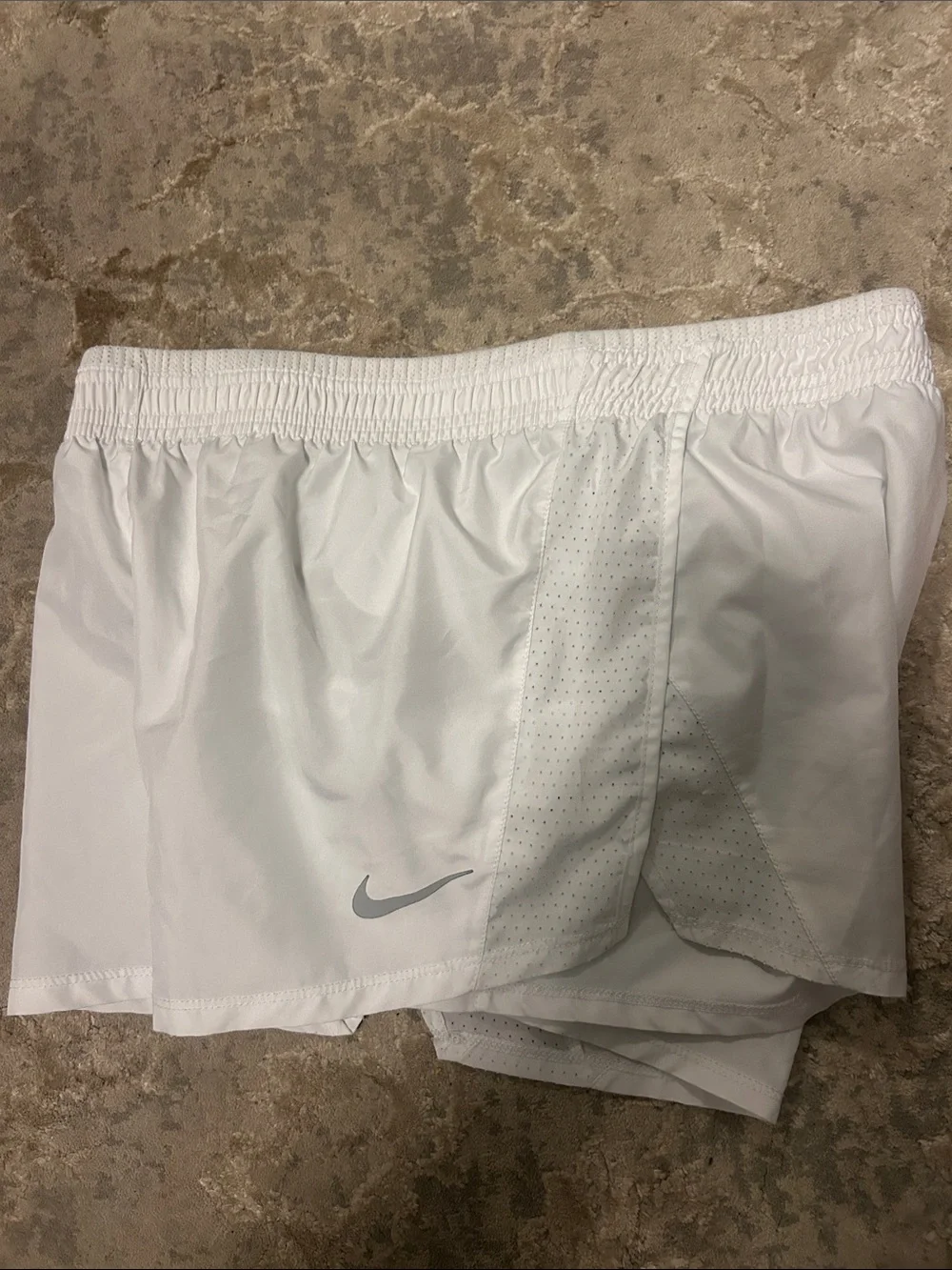 Nike Women's White Athletic Shorts with Silver Swoosh
